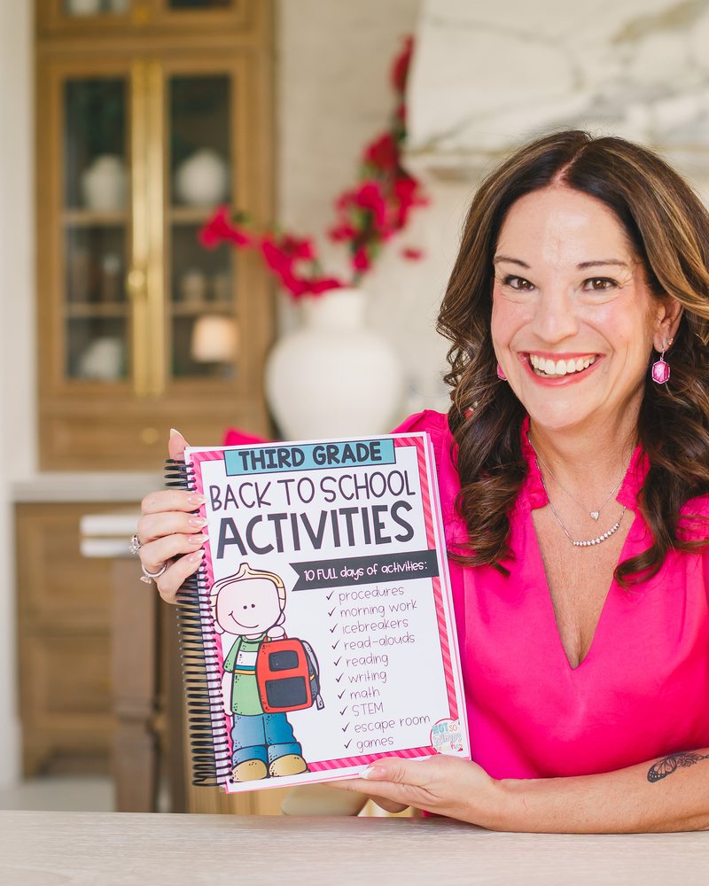 Jamie smiling and holding a Third Grade Back to School Activities resource book